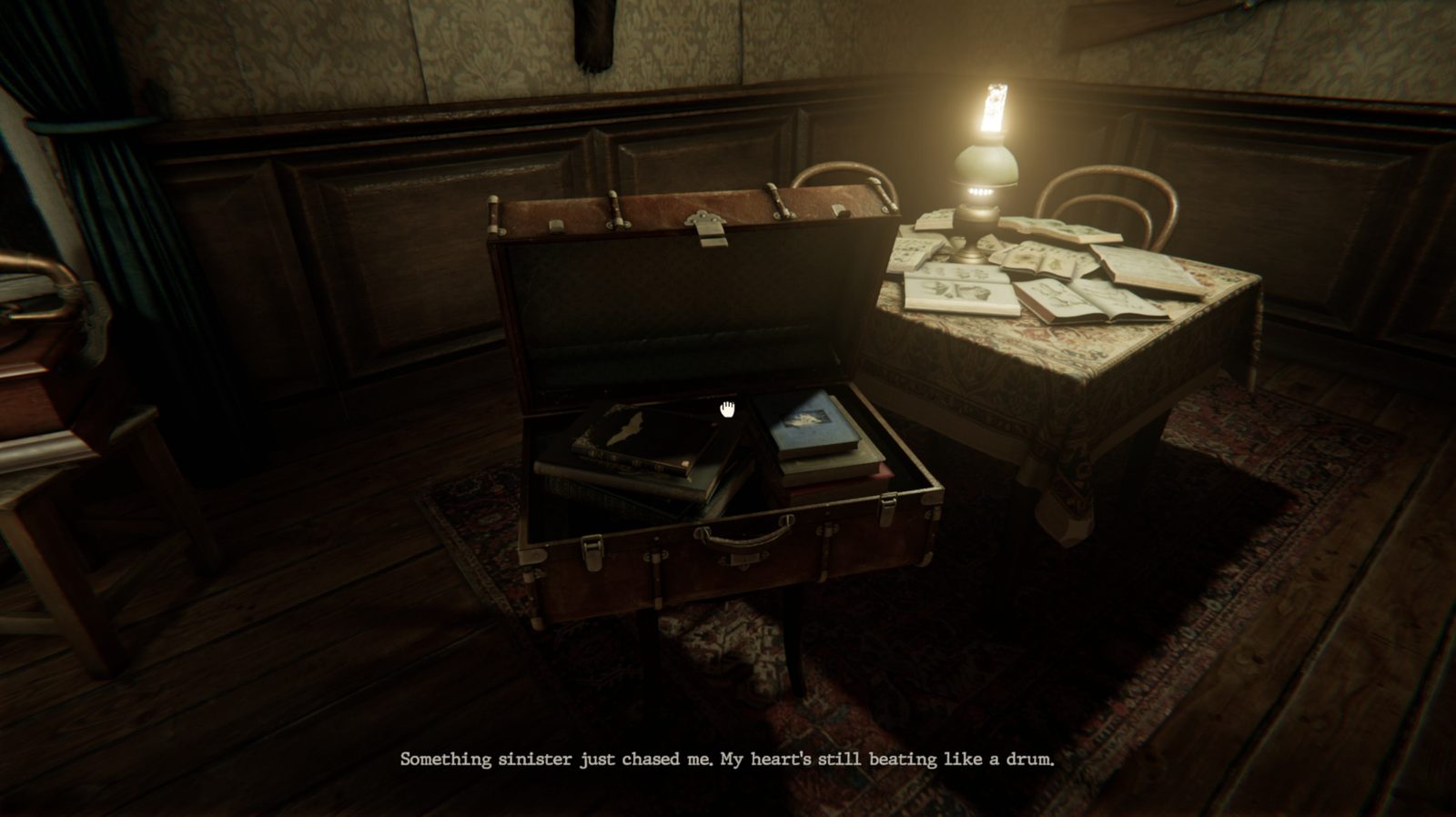 A suitcase and a gramophone on a desk